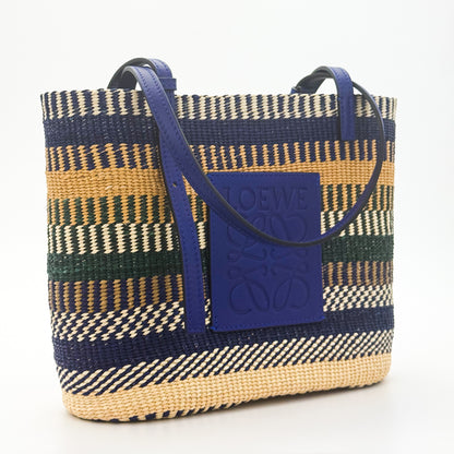 Loewe x Paula's Ibiza Square Basket Bag in striped raffia with cobalt blue leather handles — front view
