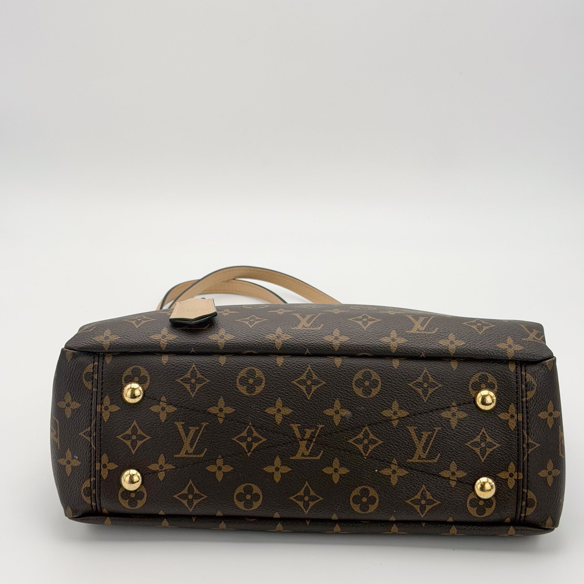 Preloved Louis Vuitton Pallas Shopper tote base view showing gold hardware studs