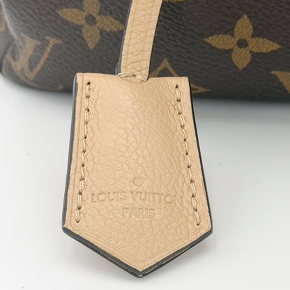 Second hand Louis Vuitton Pallas Shopper brand stamp detail on Dune leather trim