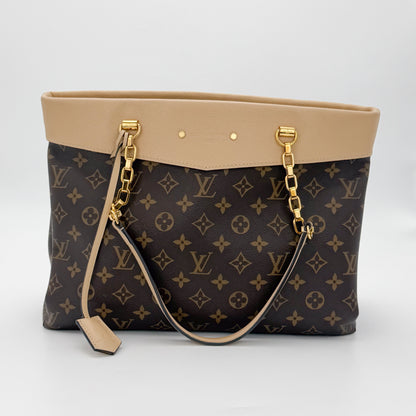 Used Louis Vuitton Pallas Shopper brand tag close up with embossed logo