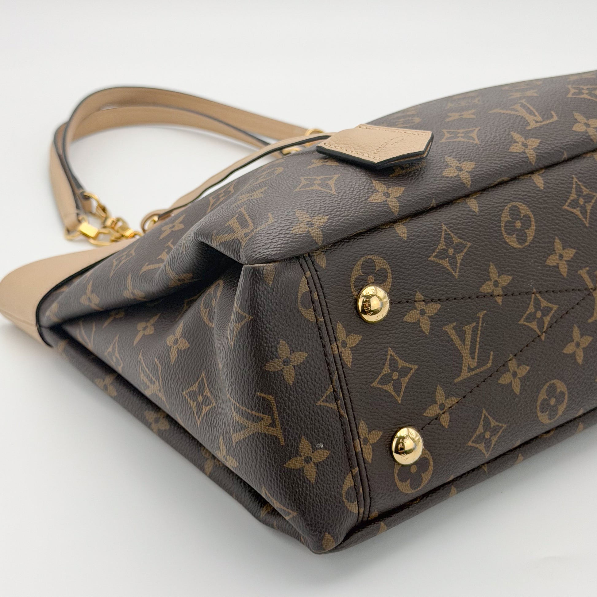 Preloved Louis Vuitton Pallas Shopper tote base angled view showing canvas and studs