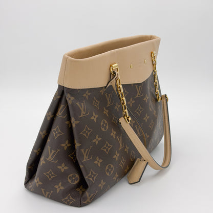 Second hand Louis Vuitton Pallas Shopper monogram canvas side view with gold studs and chain strap