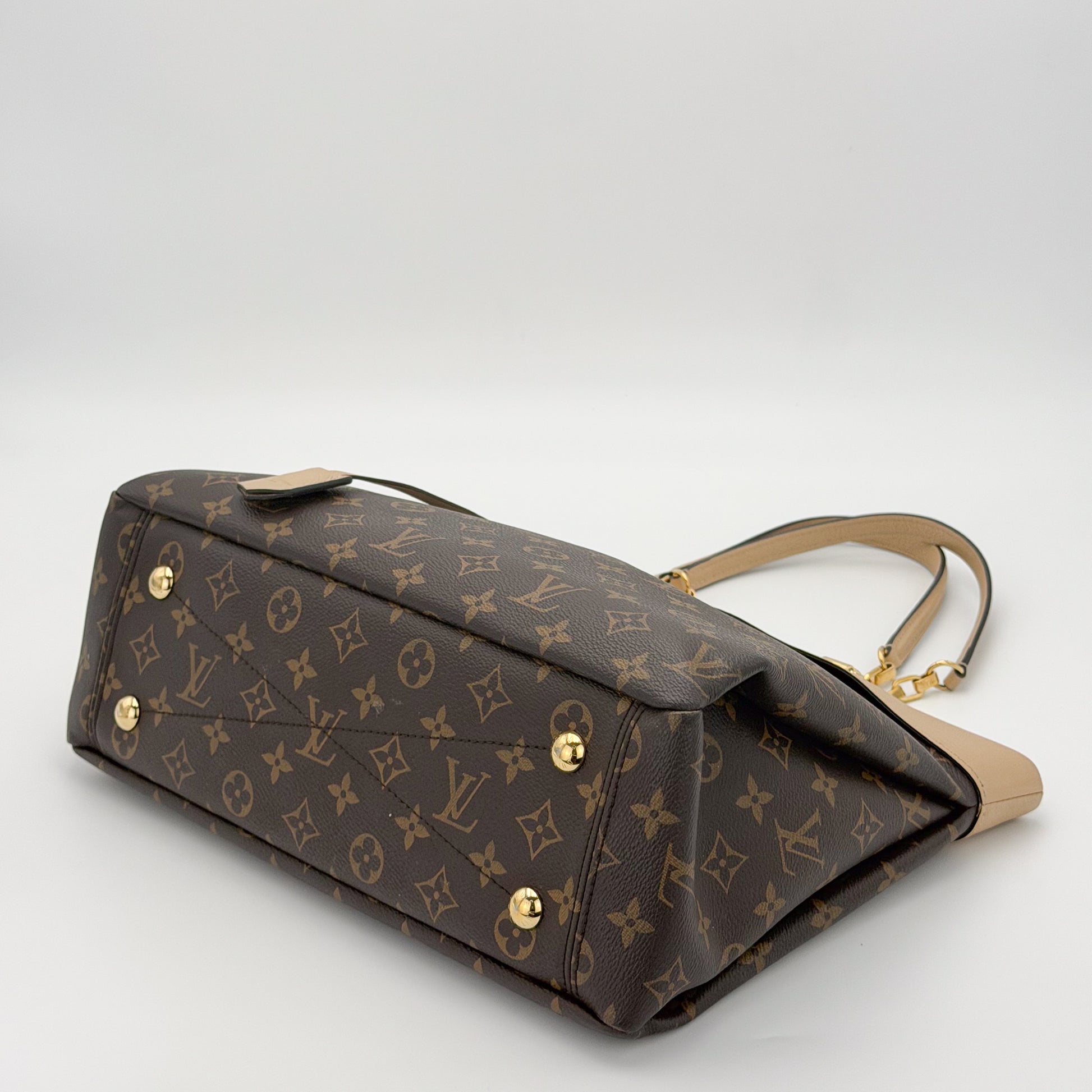 Preloved Louis Vuitton Pallas Shopper tote base view showing gold hardware studs