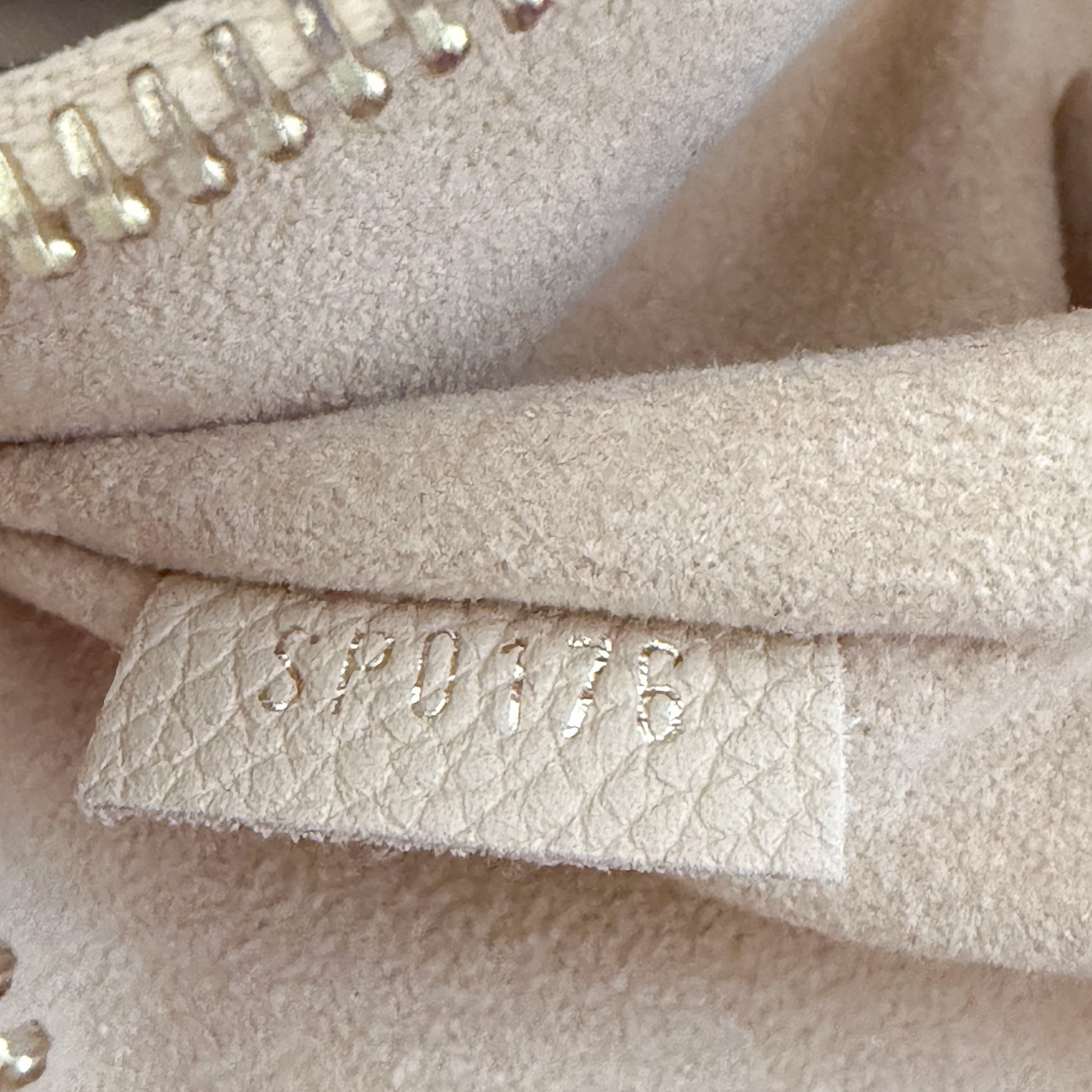 Louis Vuitton date code stamp close up reading SP0176 authenticity detail
