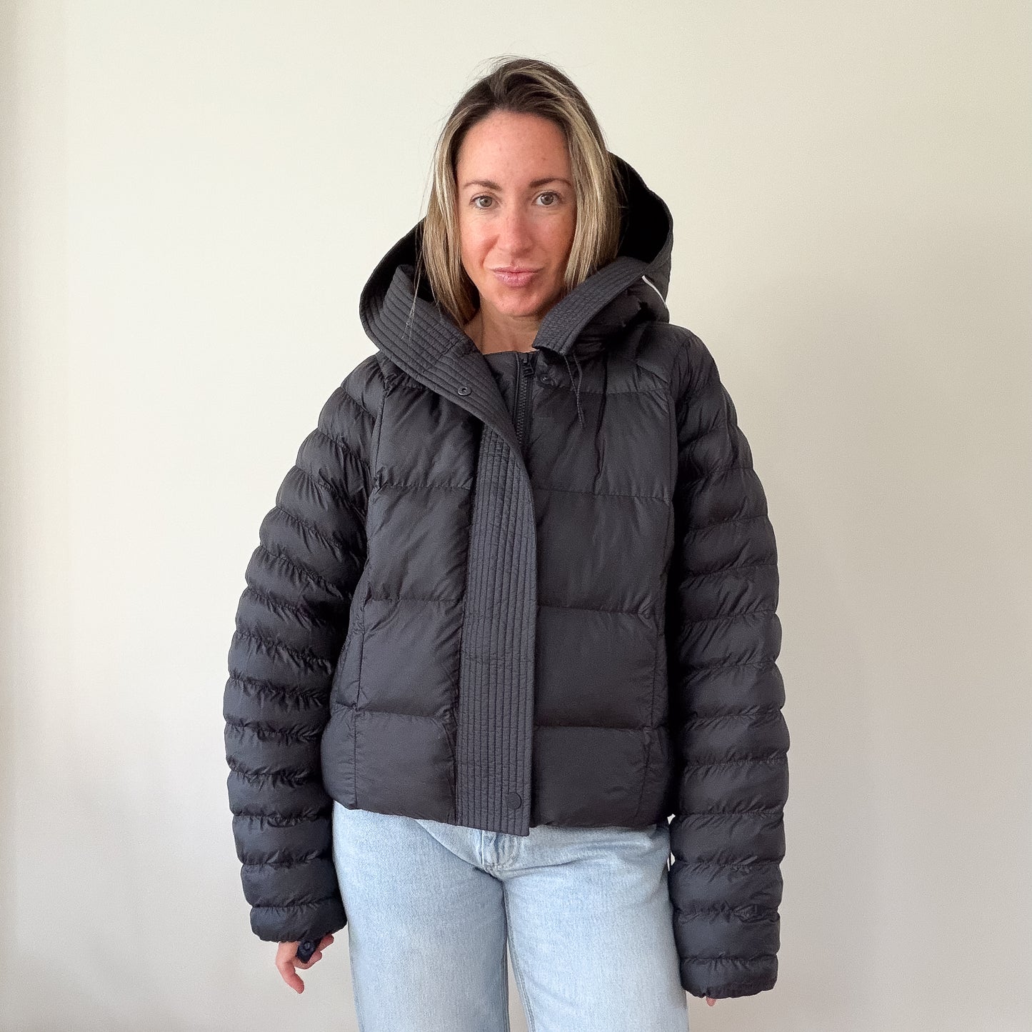 Nike black hooded puffer jacket — front view with hood up
