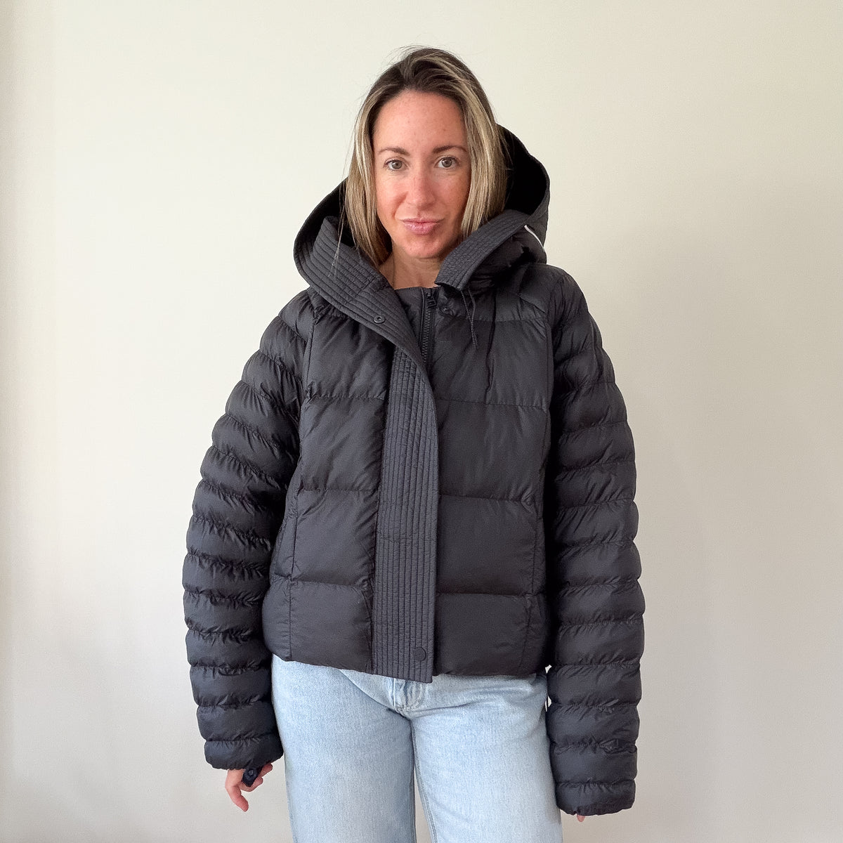 Nike black hooded puffer jacket — front view with hood up