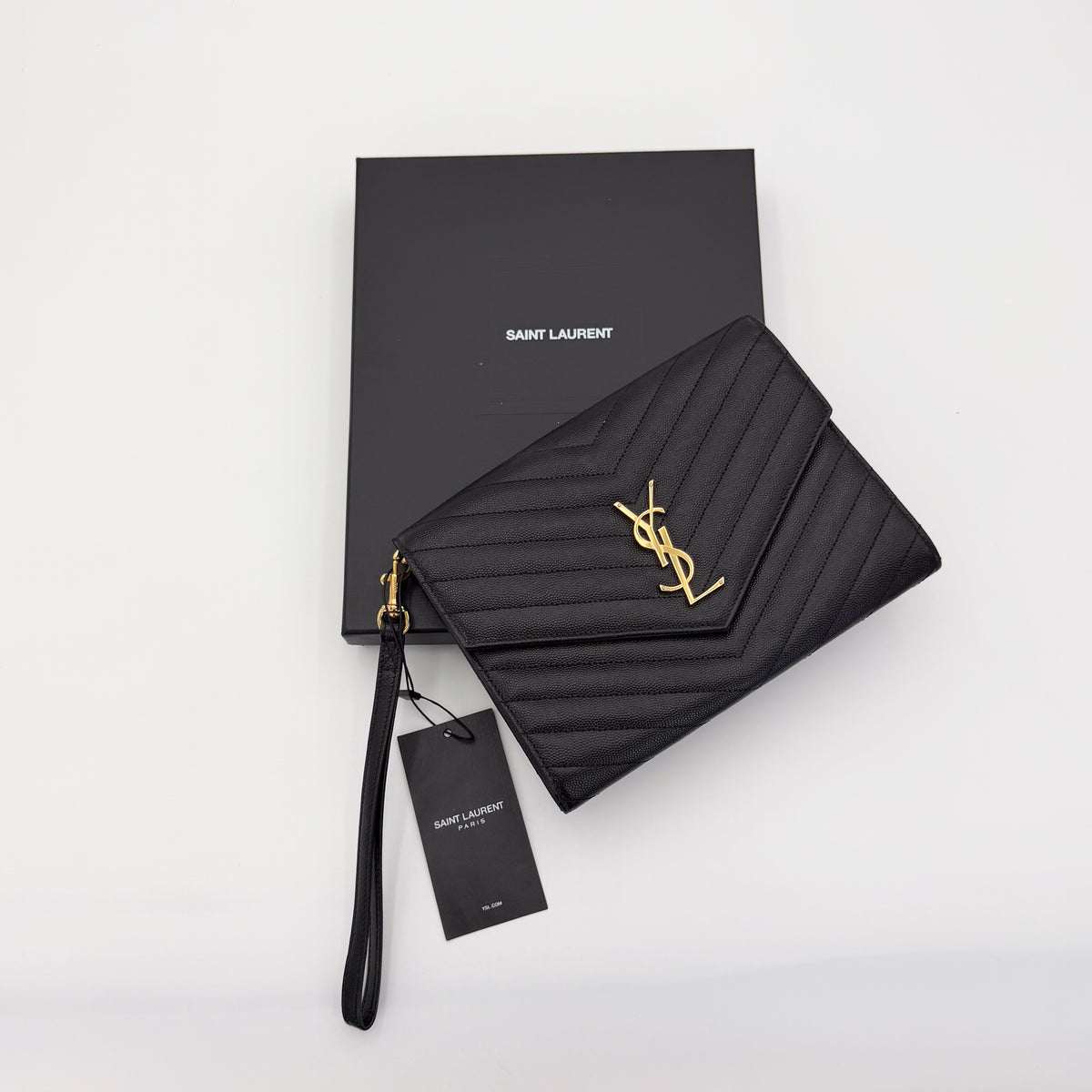 Saint Laurent Cassandre Matelassé Flap Pouch – front view with retail box and tag