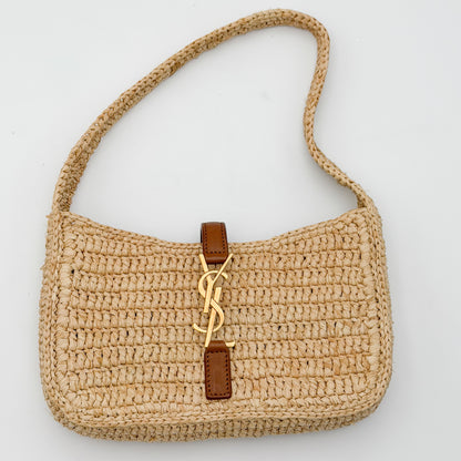 Used Saint Laurent mini raffia hobo bag upright angled view with crochet shoulder strap