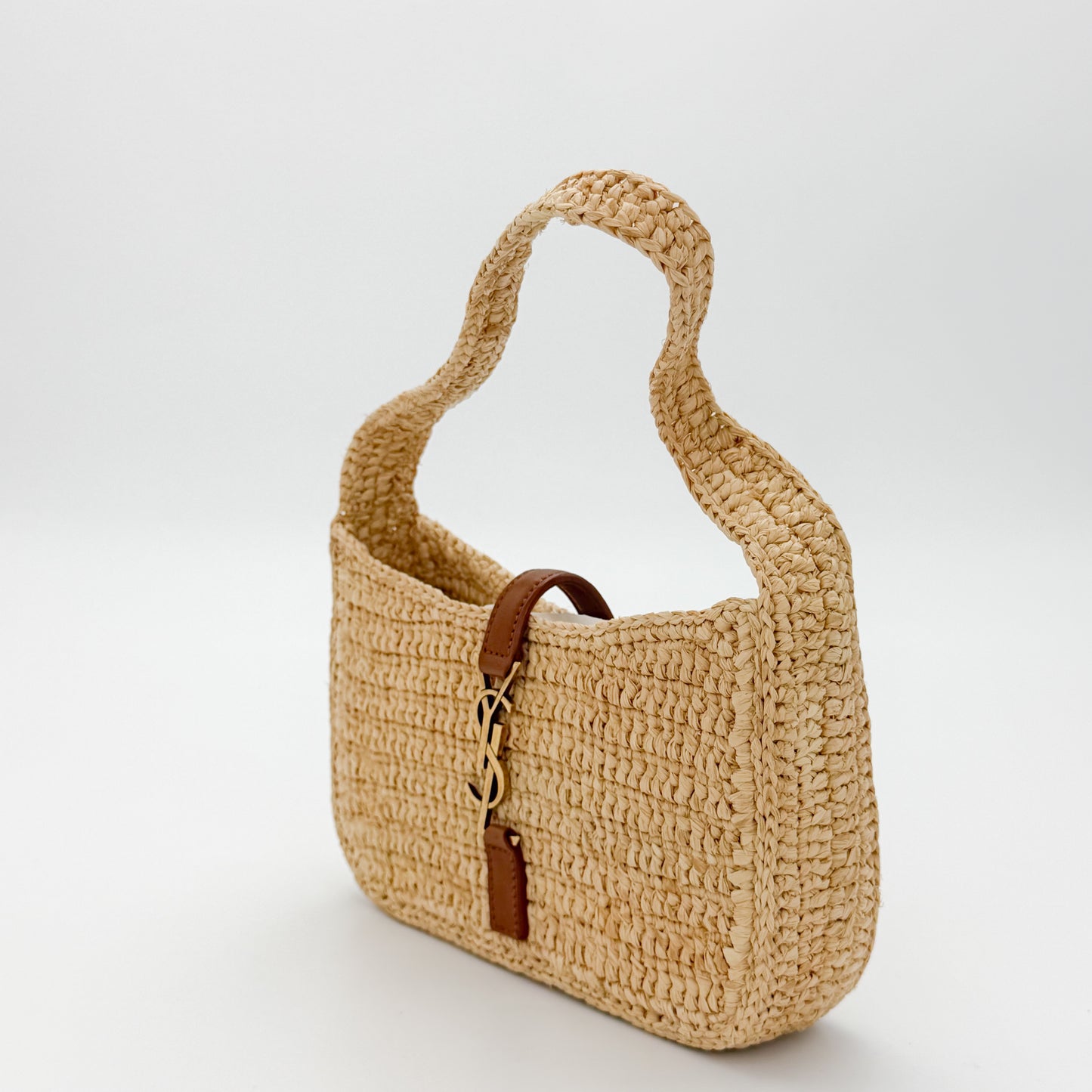 Second hand Saint Laurent raffia hobo bag left side view with tan leather trim