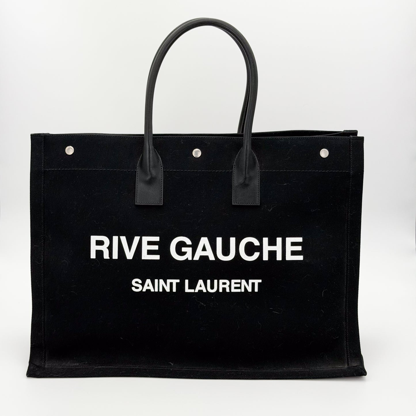 Saint Laurent Rive Gauche canvas tote front view with wordmark